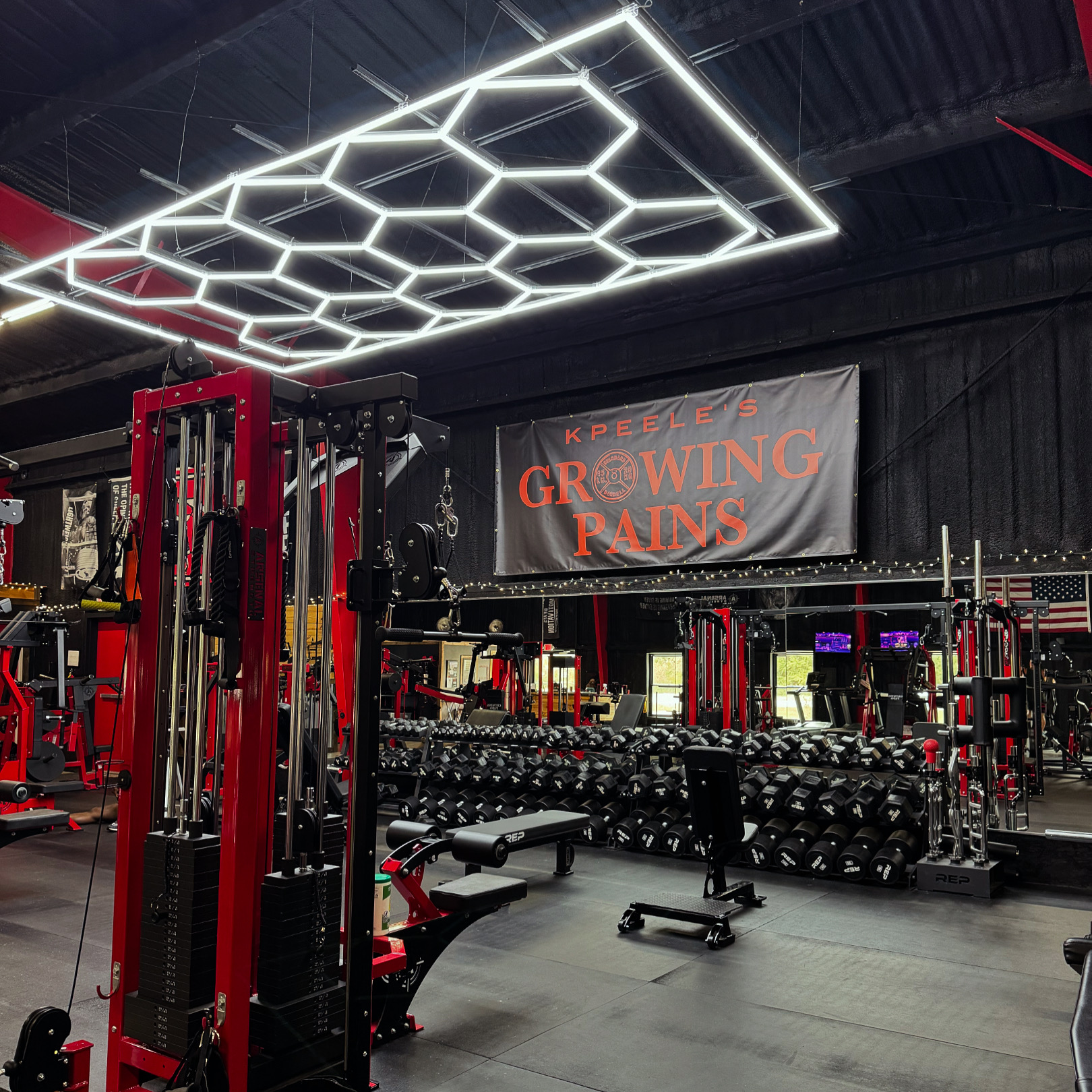 Free weight area with dumbbells at Growing Pains Gym in Tifton, GA